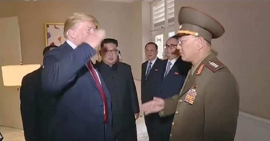 image of Trump giving military salute to top ranking North Korean military official