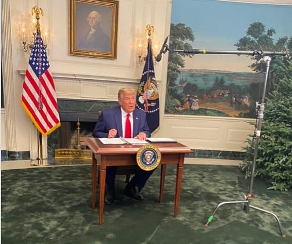 Trump in the Diplomatic Reception Room sitting behind the now notorious "Tiny Desk" conducting a press conference on November 27, 2020